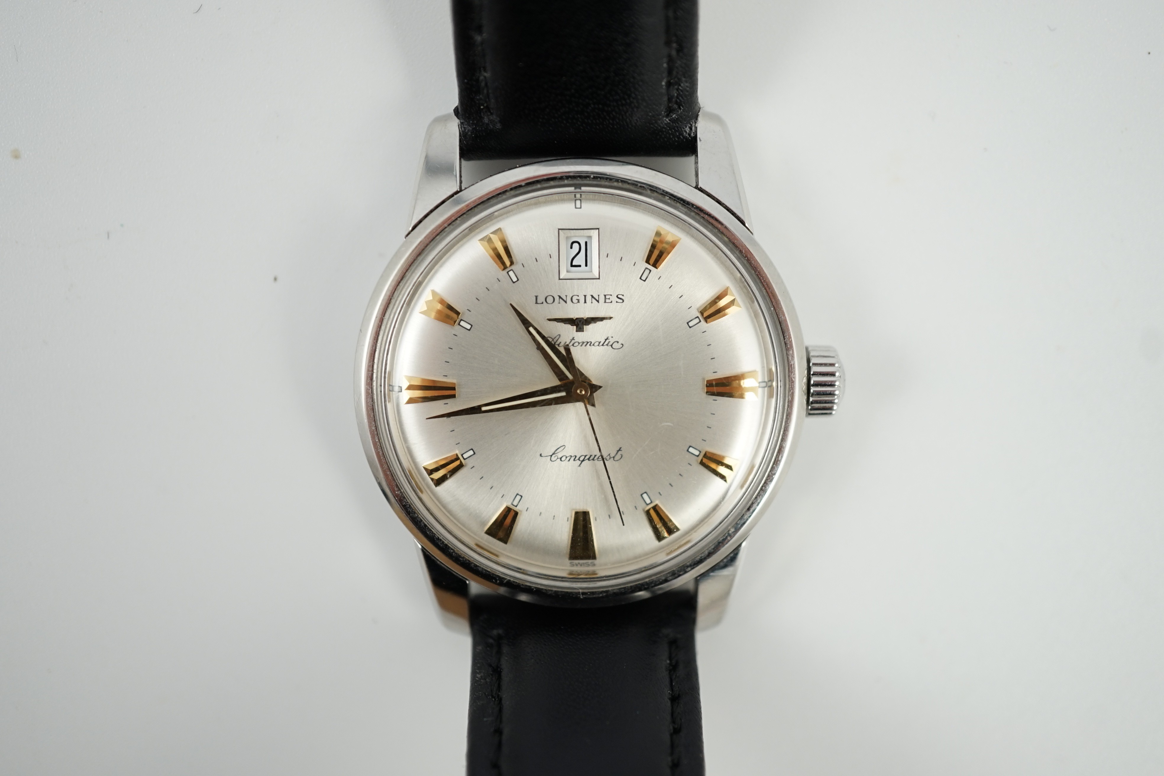 A gentleman's steel and enamel Longines Conquest Automatic wrist watch, with date aperture, case diameter 36mm, on a later associated leather strap.
